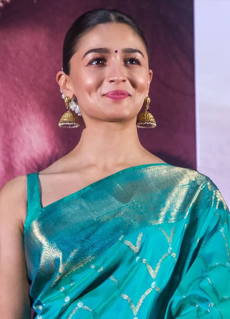 Editorial gallery of Alia Bhatt styled in cool winter outfits featuring sapphire, amethyst, and inky neutrals, highlighting glacier blue, raspberry, graphite, arctic white, and ultra black.