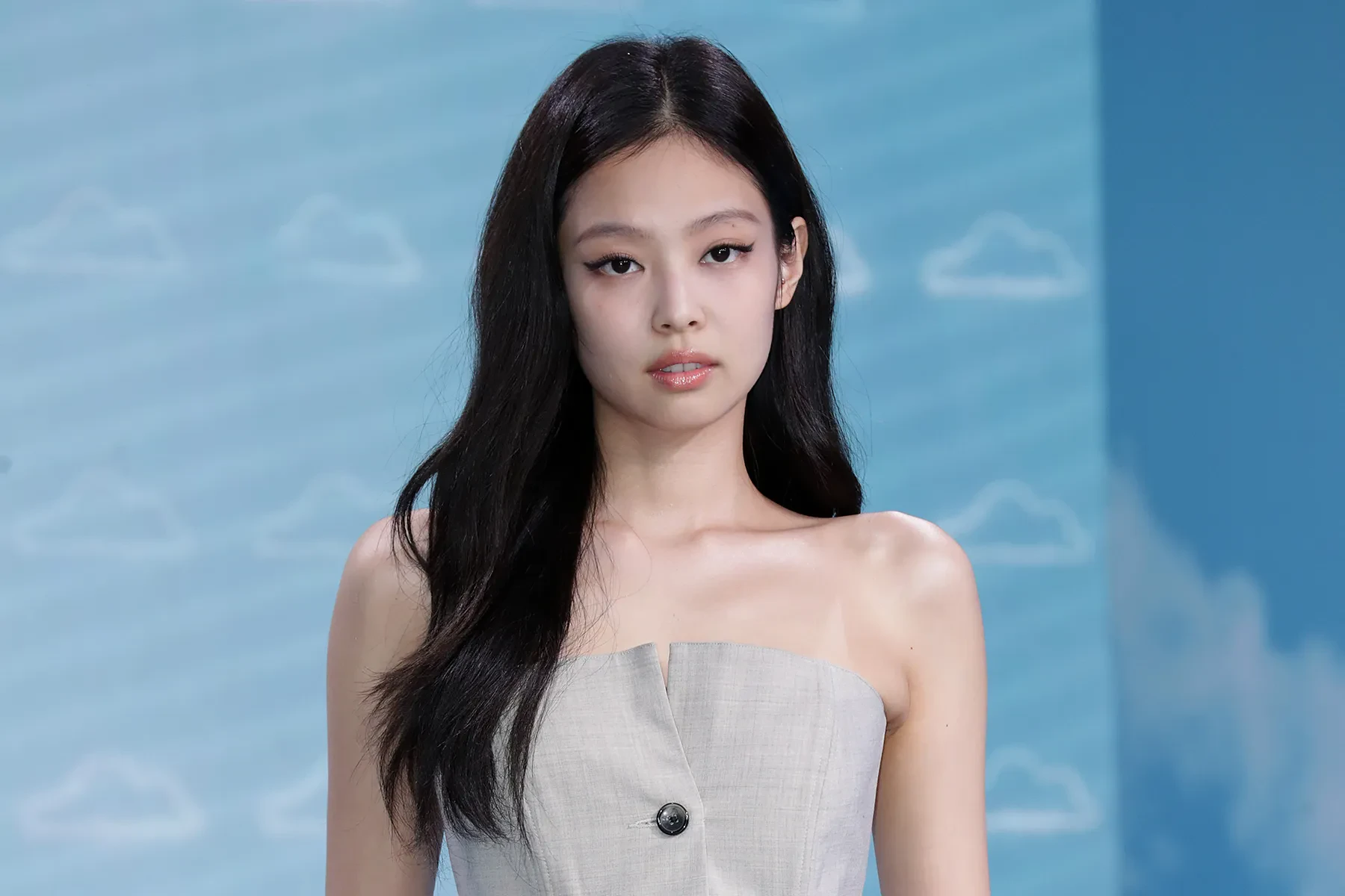 Editorial gallery of Jennie (BLACKPINK) styled in bright winter looks with electric blues, magenta accents, and polished black, highlighting electric cobalt, icy magenta, optic white, chrome silver, and inky black.